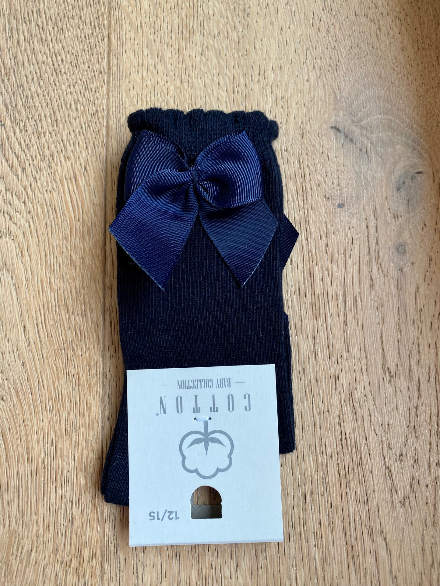 Marine blauwe kniekous met strik