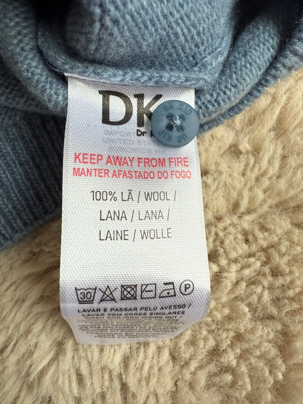 Lichtblauwe wollen pull met beer - dr. Kid
